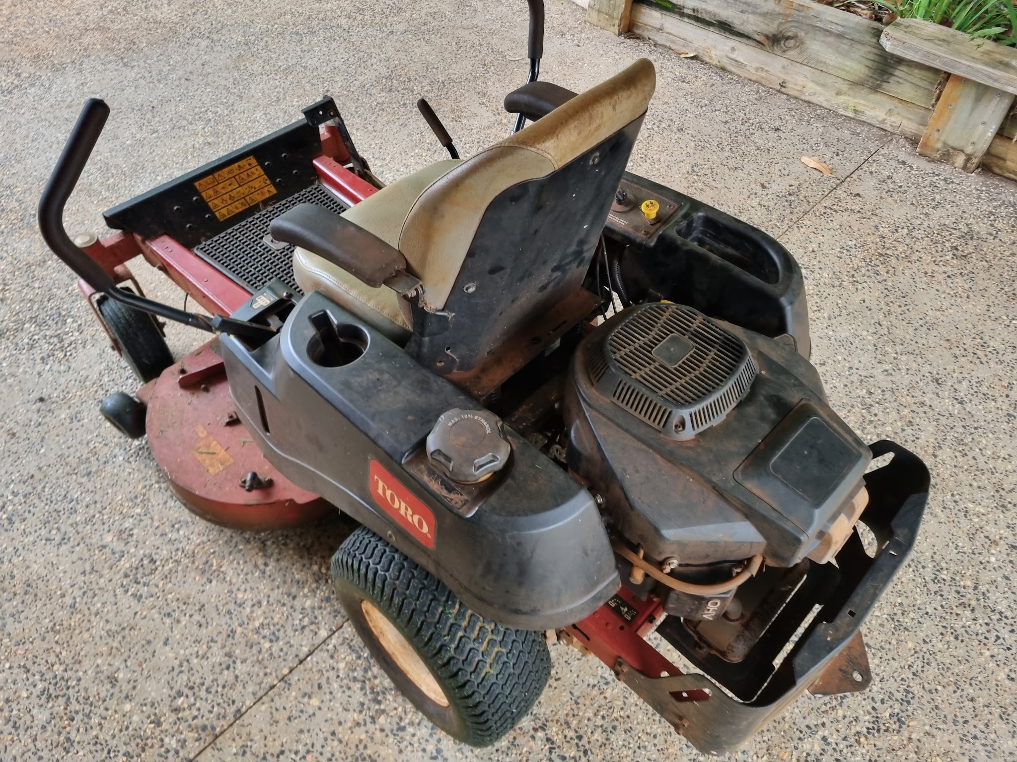 A Toro zero-turn mower on the driveway ready to go back to its owner