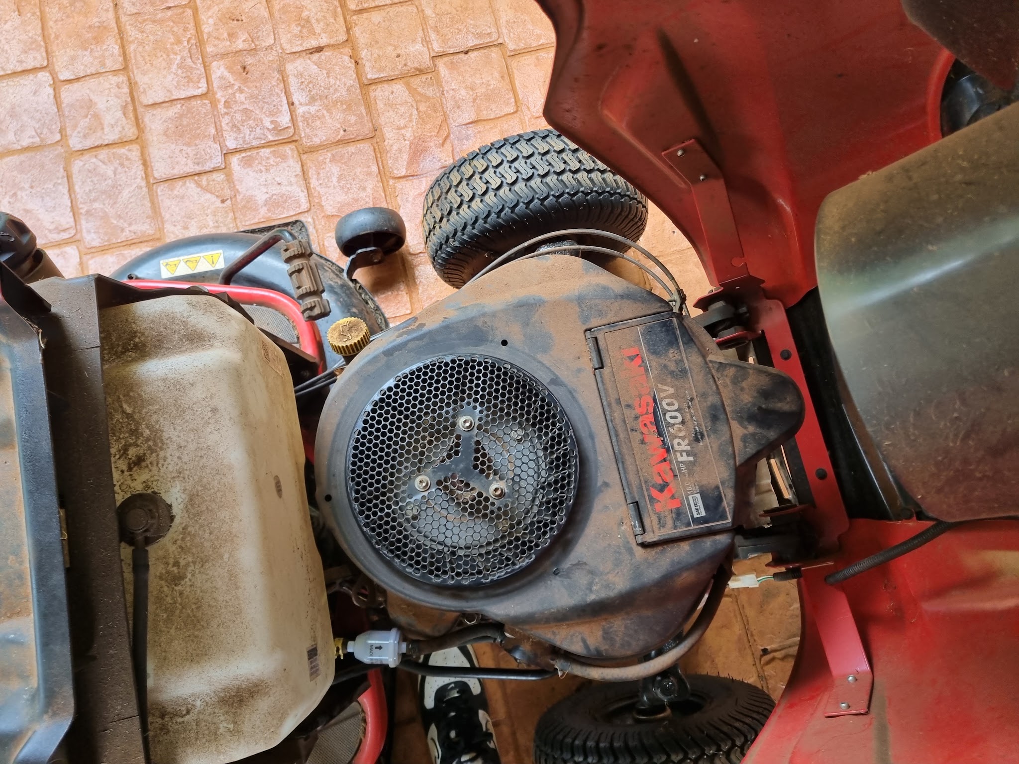The Kawasaki engine on a ride-on mower, cover off